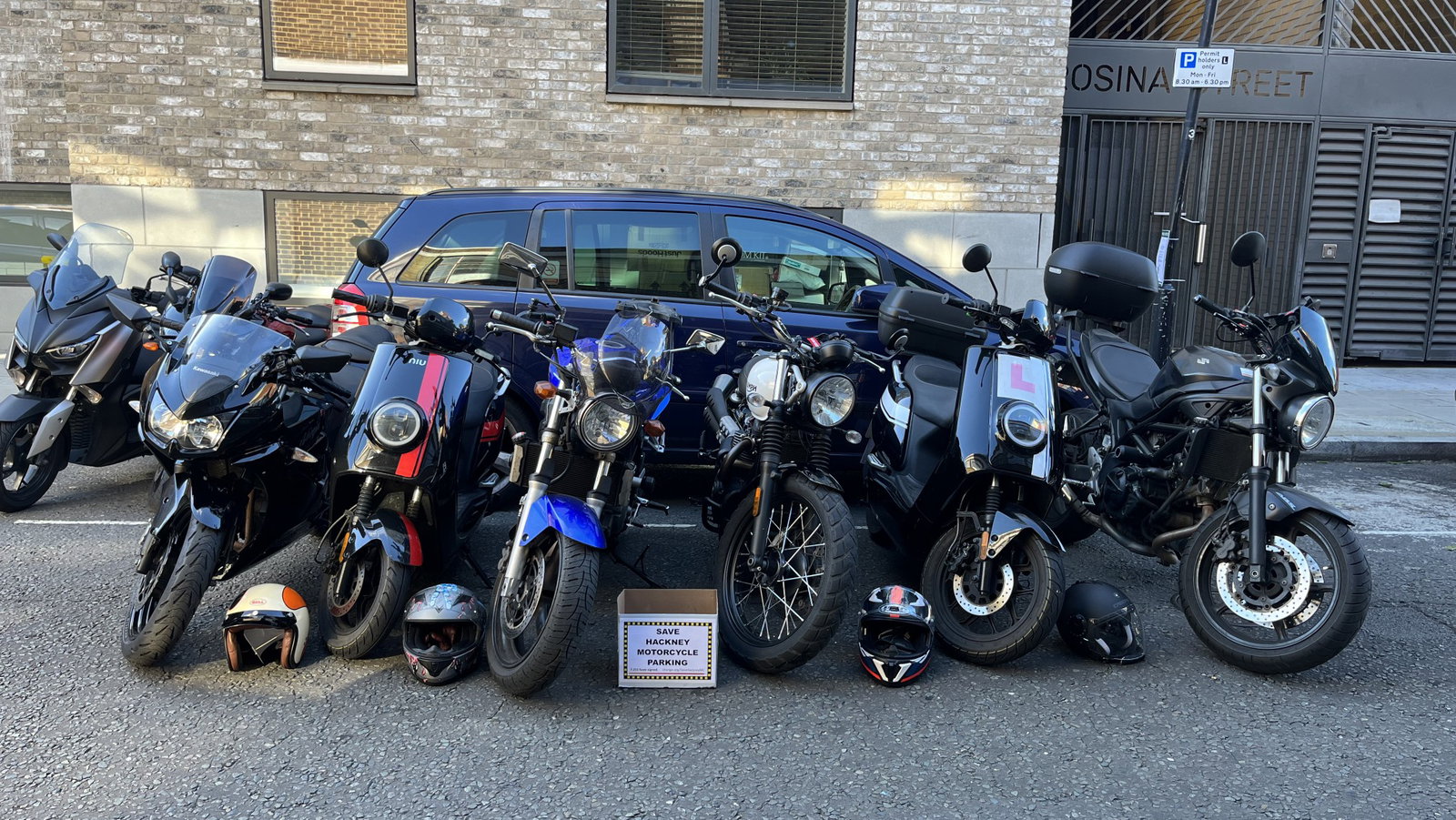 Several motorcycles parked int eh same space as one car. - Save London Motorcycling